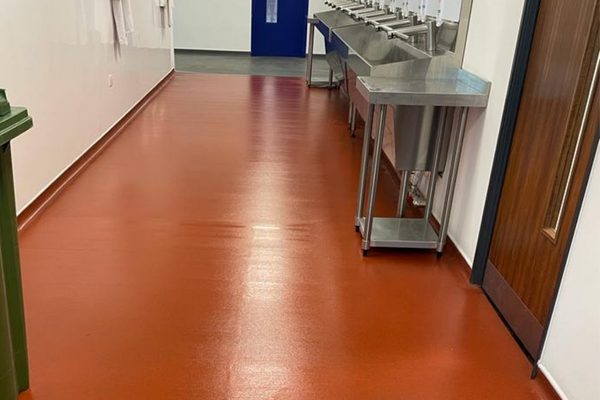 hard floor cleaning in a factory hallway
